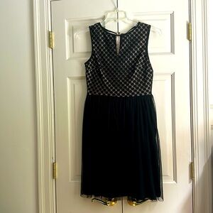 London Times offers this woman’s size 6 elegant ballet style dress with keyhole.